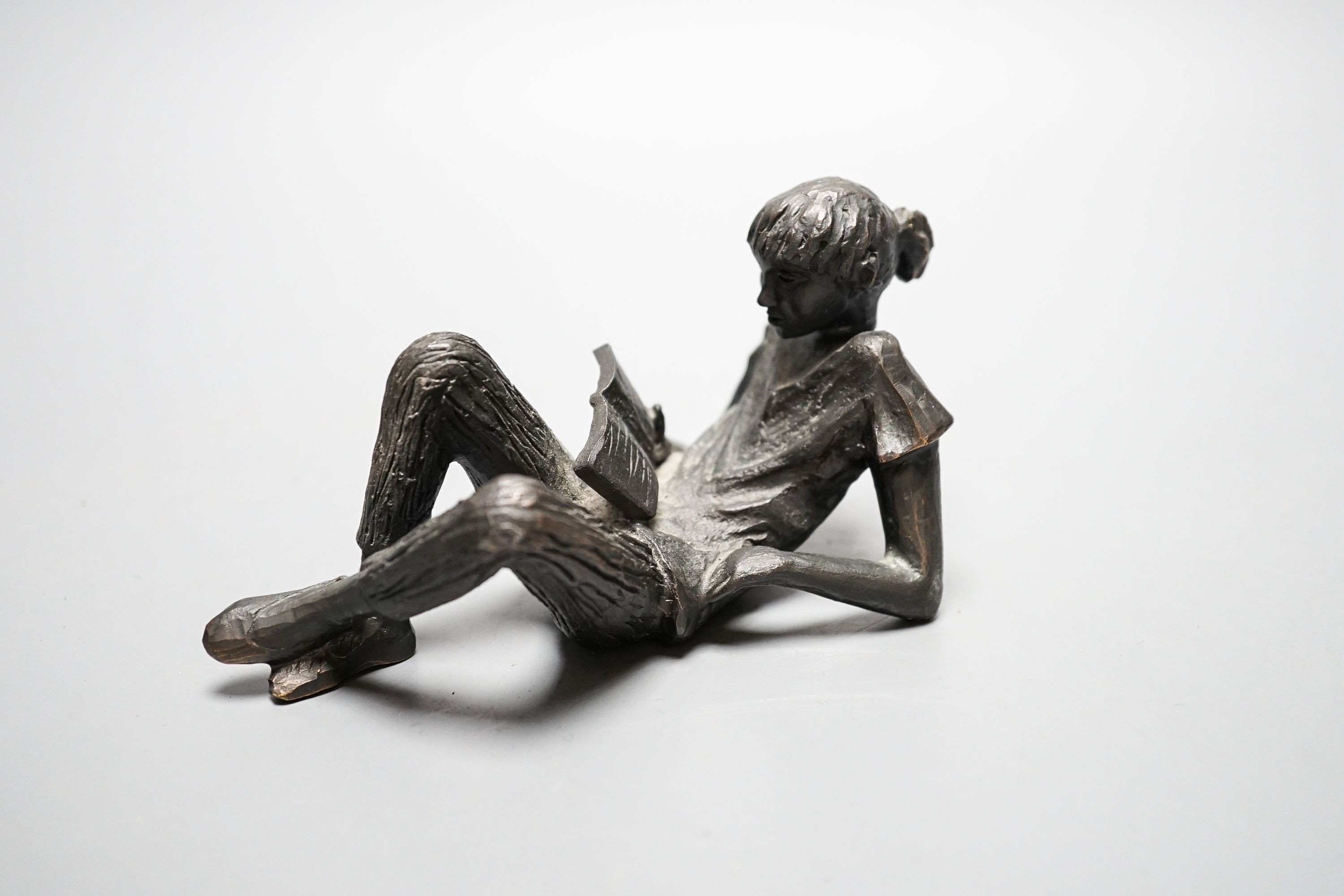 Gerda Rubinstein, (b. 1931). A bronze reclining girl, width 13cm